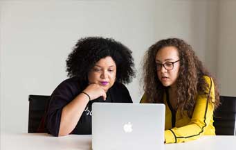 women looking at computer
